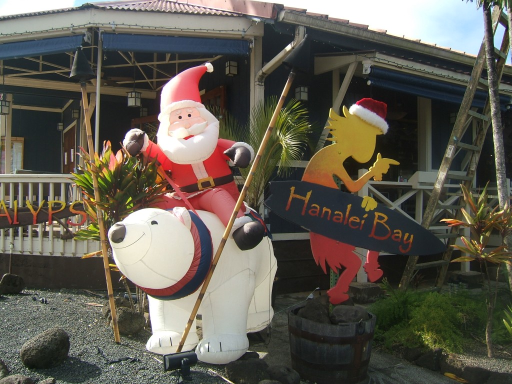 Santa's Riding a Polar Bear between the Tiki Torches